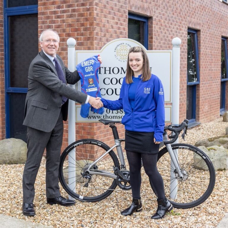 Senior Partner Andrew Croxford and Jayne Emery with competiton bike 1024x1024 1 768x768